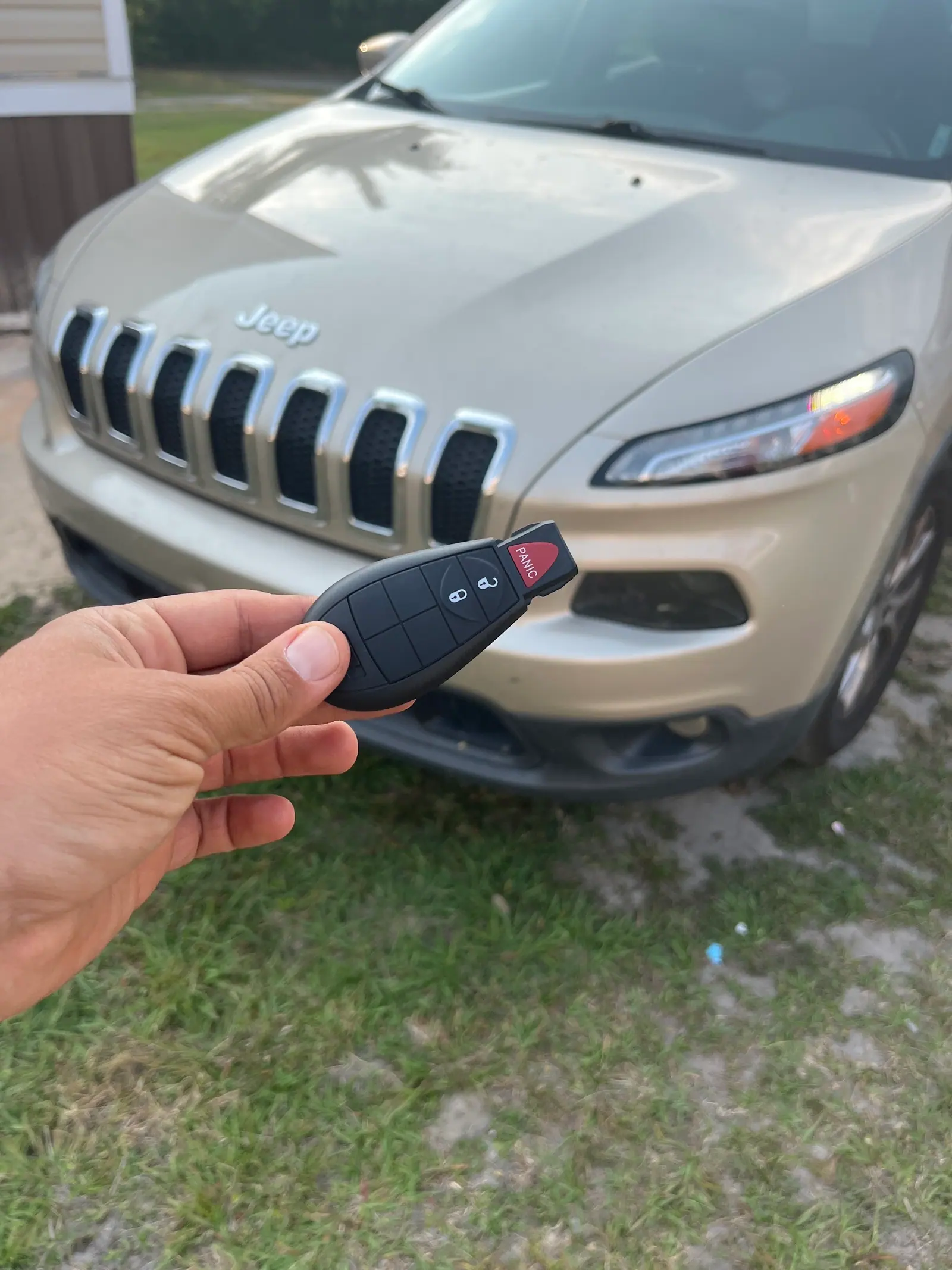 Customer photograph of a key beside a Jeep